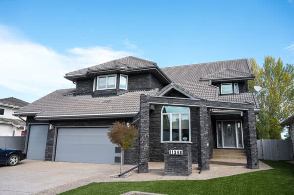 Stone and stucco work on a home in Edmonton by Met Exteriors.