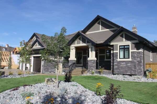 Large home in Edmonton's Cameron Heights neighbourhood with a stone and stucco exterior.