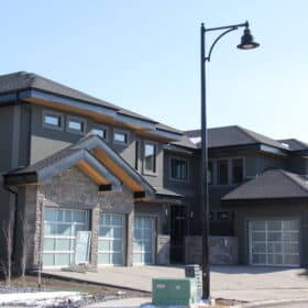 A large home in the Magrath area of Edmonton with an extensive stone and stucco exterior by Met Exteriors.