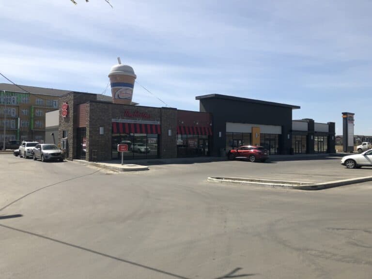Shopping centre in Edmonton featuring a Tim Hortons with stone and stucco exterior.