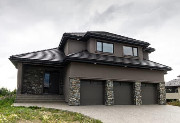 Dark stucco with stone features on a home in Edmonton's Wheaton Drive neighbourhood.