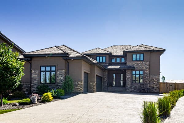 Windemere, Edmonton home with extensive stone and stucco work by Met Exteriors.