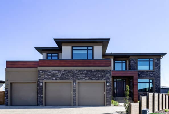 Stone and stucco work on a large home in the residential neighbourhood of Windemere in Edmonton.