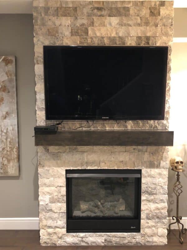 White marble splitface stone on an interior fireplace and feature wall.