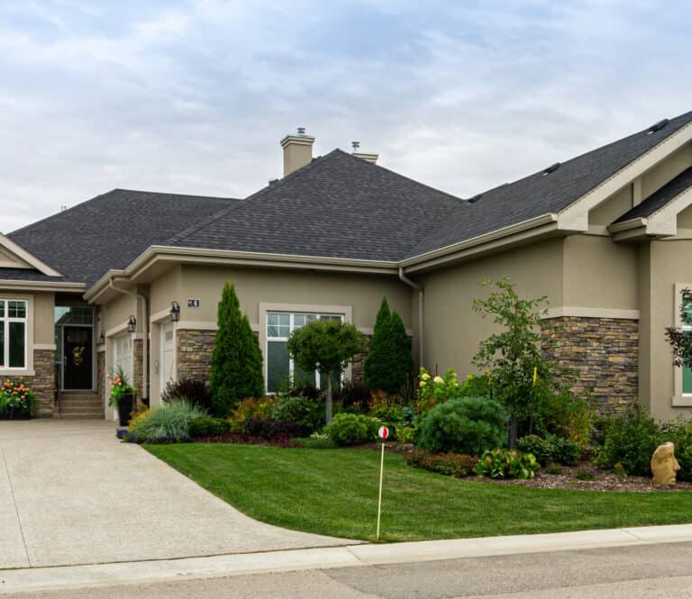 Stone and stucco on a residential home in The Cascades - Edmonton, Alberta