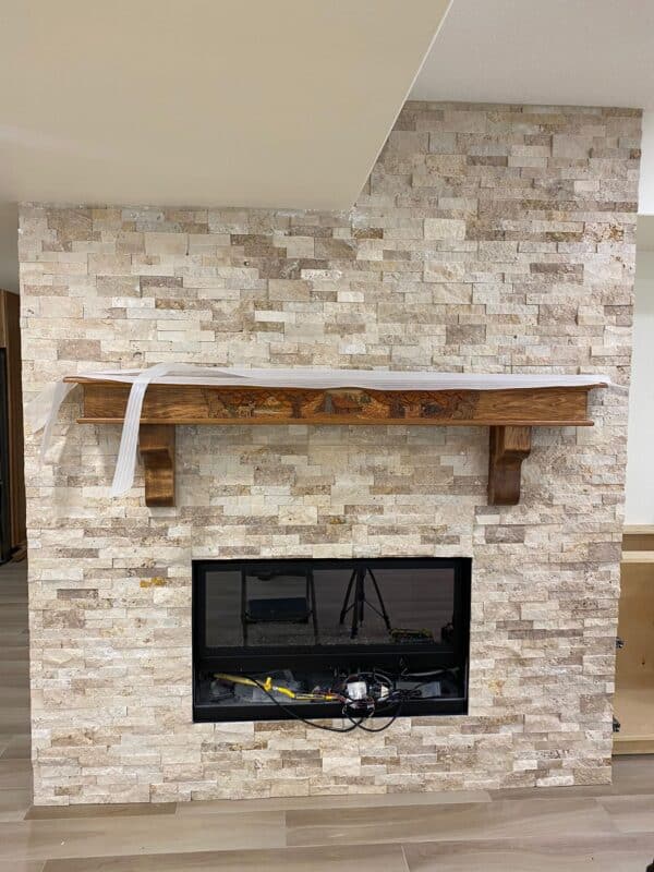 Rustic ledger panel stone work on an interior fireplace.